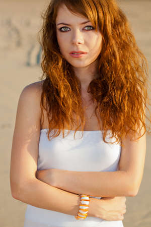 closeup red-haired woman portrait outdoorsの写真素材