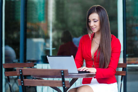 beautiful brunette businesswoman  in outdoors cafeの写真素材
