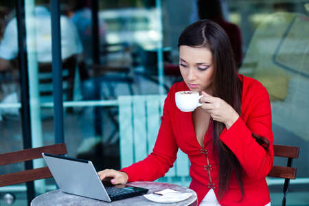 beautiful brunette businesswoman  in outdoors cafeの写真素材