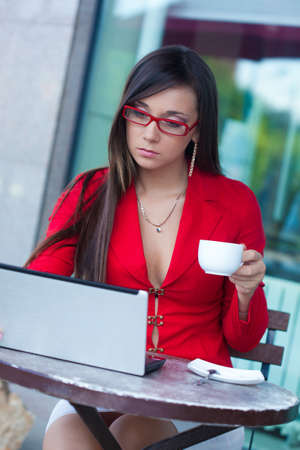 beautiful brunette businesswoman  in outdoors cafeの写真素材