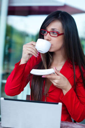 beautiful brunette businesswoman  in outdoors cafeの写真素材