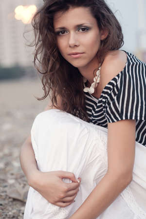 beautiful brunette  woman portrait sitting の写真素材