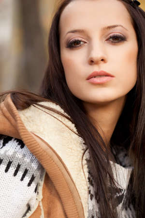 closeup beautiful autumn woman portrait in parkの写真素材