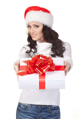 woman wearing christmas hat woman giving the gift boxの写真素材