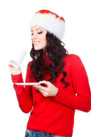 happy woman holding a coffee mug and plate, over white backgroundの写真素材