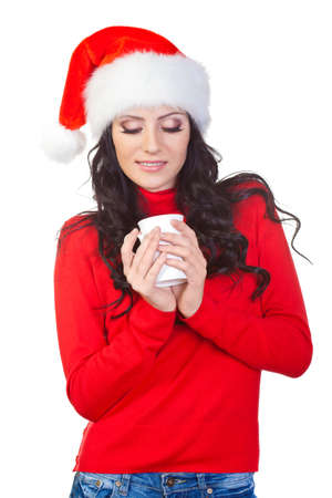woman wearing red sweater  looking to the coffee mugの写真素材
