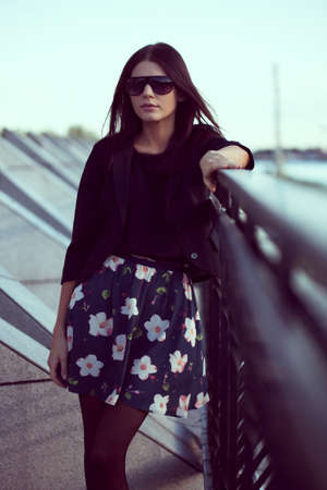 fashion model wearing sunglasses outdoorsの写真素材