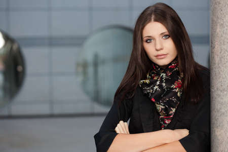 closeup woman portrait outdoors near columnの写真素材