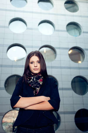 brunette woman portrait over urban backgroundの写真素材