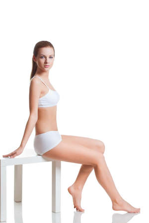 beautiful blonde woman wearing white underwearの写真素材