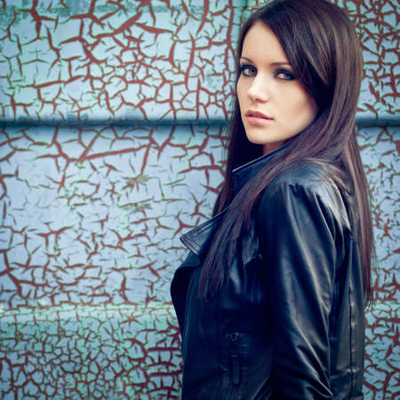 brunette woman near cracked wallの写真素材