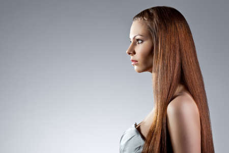beautiful woman profile portrait with long hairの写真素材
