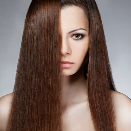 closeup  woman face with long hair. Studio portraitの写真素材