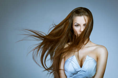 beautiful woman with flying to the right hair.  Studio portraitの写真素材