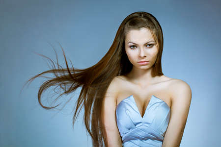 beautiful woman with flying to the right hairの写真素材