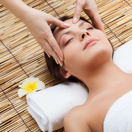 massage of face for woman in spa salonの写真素材