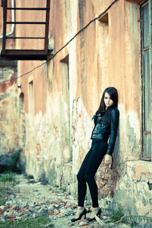 brunette woman wearing leather jacketの写真素材