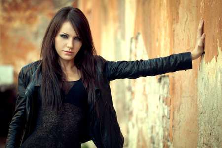 sexy woman near old wallの写真素材