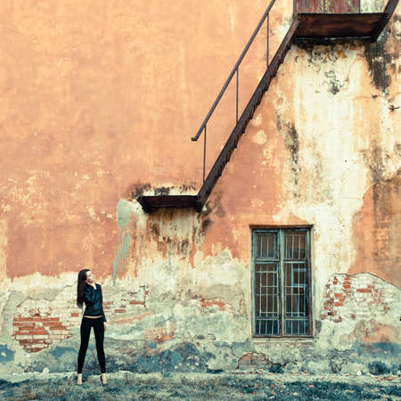 woman on ruins look at stairwayの写真素材