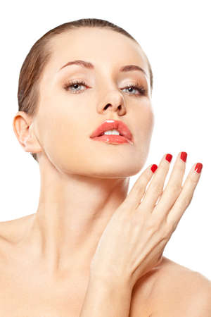 closeup woman portrait with red nails over whiteの写真素材
