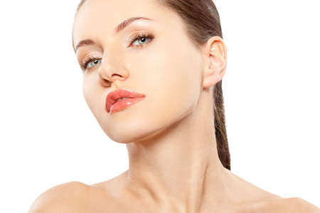 beautitful woman closeup face portrait over white backgroundの写真素材