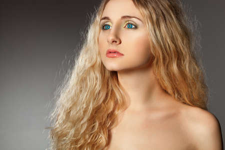 closeup woman portrait with shoulder, looking far awayの写真素材