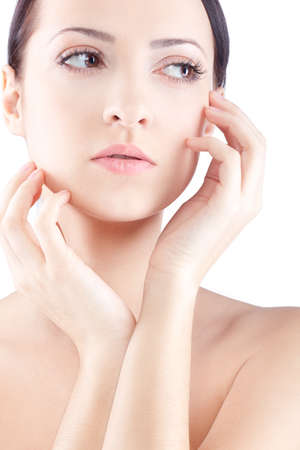 beautiful closeup woman portrait with two hands near faceの写真素材