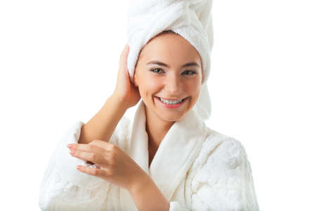 closeup woman portrait wearing bathrobe with hand head over white backgroundの写真素材
