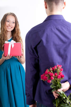 young adult couple giving presents to each otherの写真素材