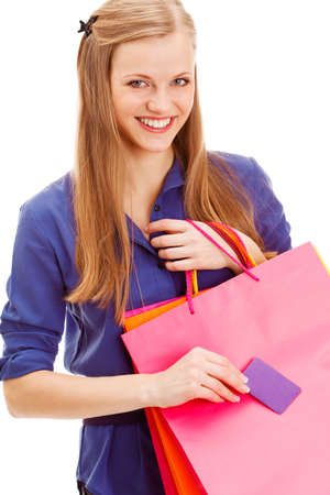 happy smiling blonde woman with shopping bags and blank  business card over white backgroundの写真素材