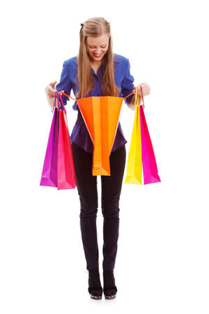 isolated blonde woman looking to shopping bagの写真素材