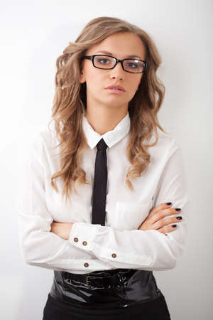 closeup seriously blonde businesswoman portrait wearing eyeglassesの写真素材