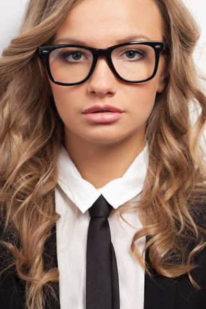 closeup seriously businesswoman wearing eyeglasses portraitの写真素材
