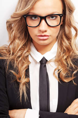 closeup seriously businesswoman wearing eyeglasses portraitの写真素材