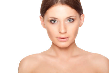 beautiful brunette woman with clear skin closeup portraitの写真素材
