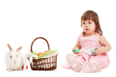 little girl playing with fur eatser rabbit over whiteの写真素材