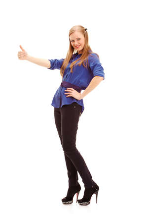 blonde woman thumbs up her finger over white background, full length portraitの写真素材