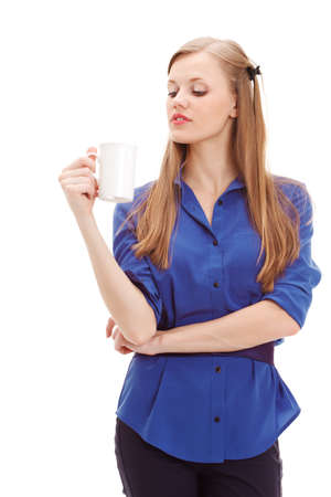 beautiful blond holding white mug over white backgroundの写真素材