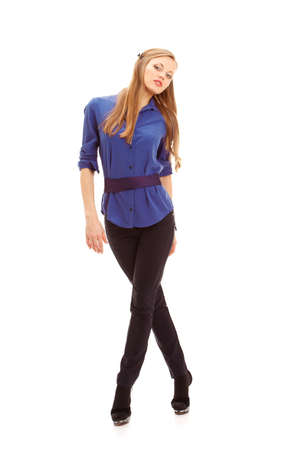 isolated beautiful blonde woman posing cross-legged on heelsの写真素材