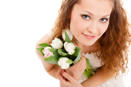 happy beautifu long haired smiling woman holding tulips, top point of viewの写真素材