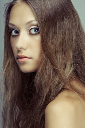 beautiful woman face portrait looking at cameraの写真素材