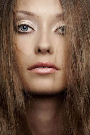 closeup beautiful woman face with hairsの写真素材