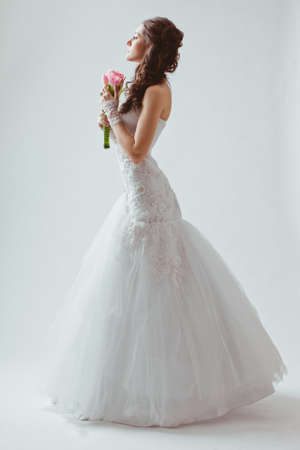 beautiful bride studio full length portrait with backlightの写真素材