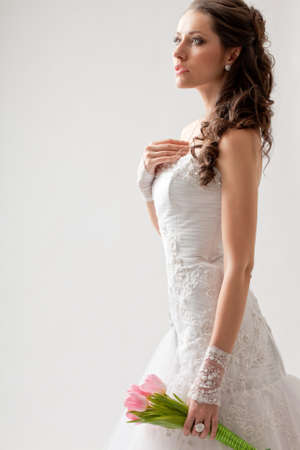 beautiful bride studio portrait with backlight, she turned sidewaysの写真素材