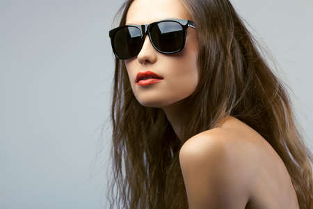 woman portrait with long hair wearing sunglassesの写真素材