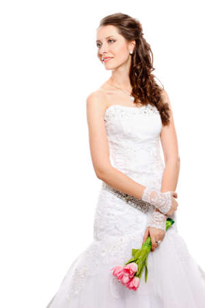 bride brunette holding pink tulips in studioの写真素材