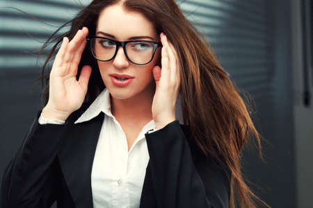 close-up portraits of a businesswoman with  flying hairの写真素材
