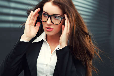 close-up portraits of a businesswoman with  flying hairの写真素材