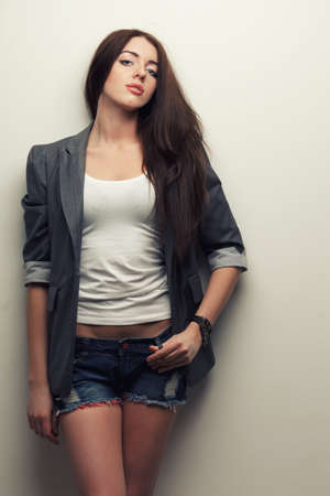 woman fashion studio portrait over white wallの写真素材