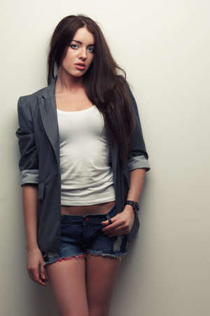 woman fashion studio portrait over white wallの写真素材